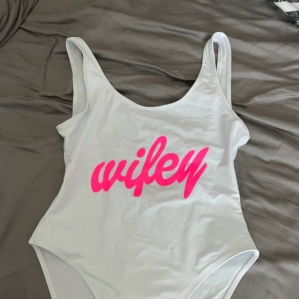 Brand new, never worn. White one piece bathing suit bride.